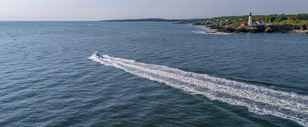Fore River Sportfishing Boat Passing Portland Head Light, Peter G Morneau Photography